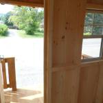 Interior of Tiny Hut, looking out front door towards porch